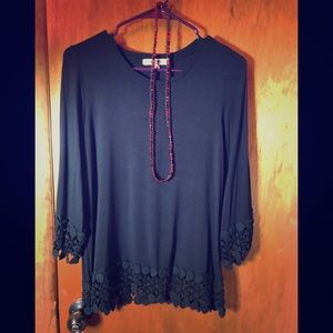 A MODBE medium sized black blouse